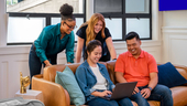SoFi team members sitting together on a couh SoFi team members sitting together on a couh